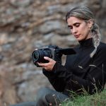 Image of a woman holding the new Canon C80